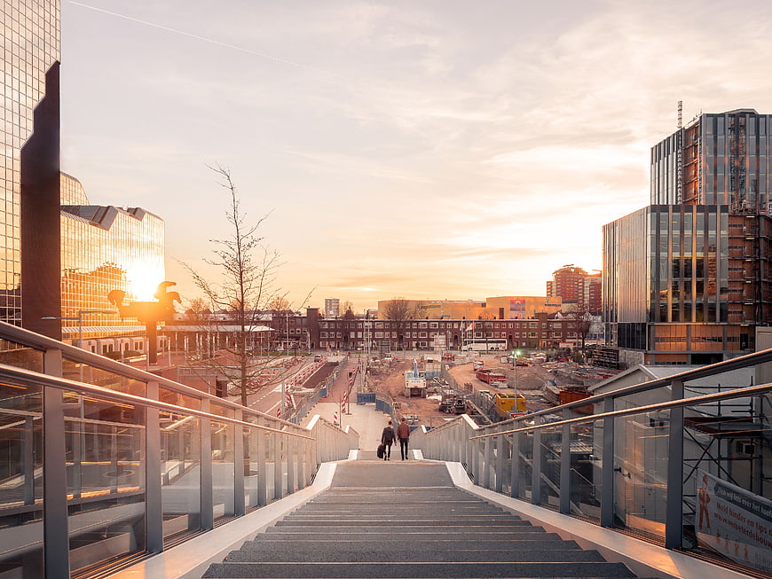 Modern city stairs at sunrise with construction site view