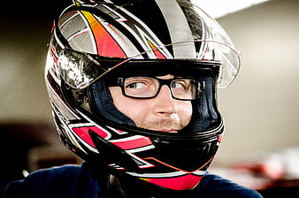 Man Wearing Racing Helmet and Glasses Looking Sideways