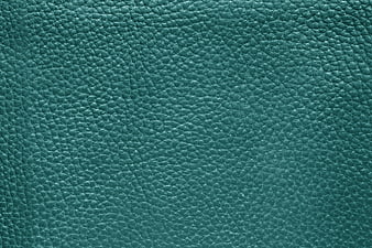 Close-up of textured teal leather surface background