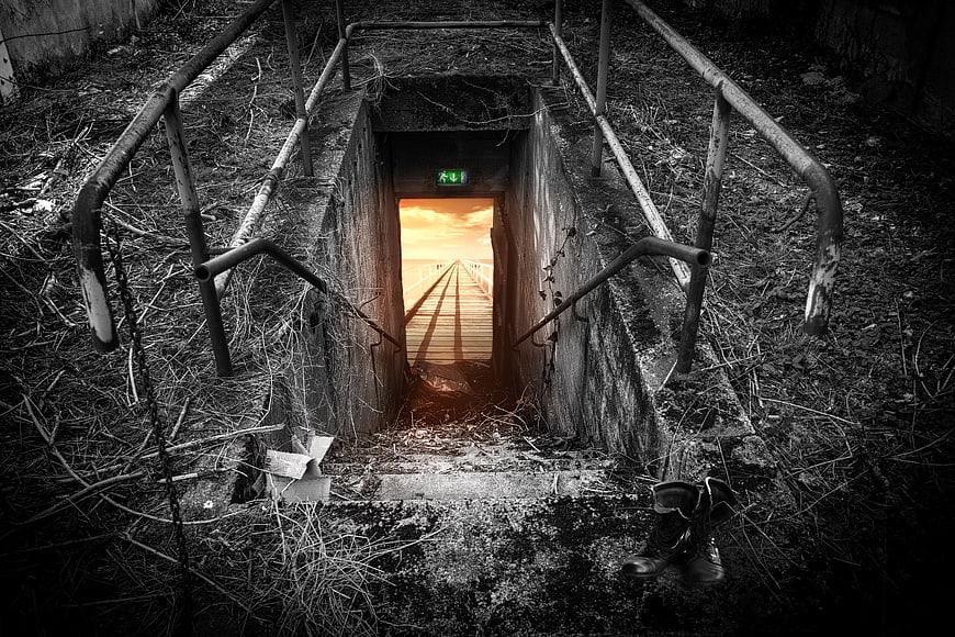 Descent to Golden Pier Through Dark Concrete Stairwell