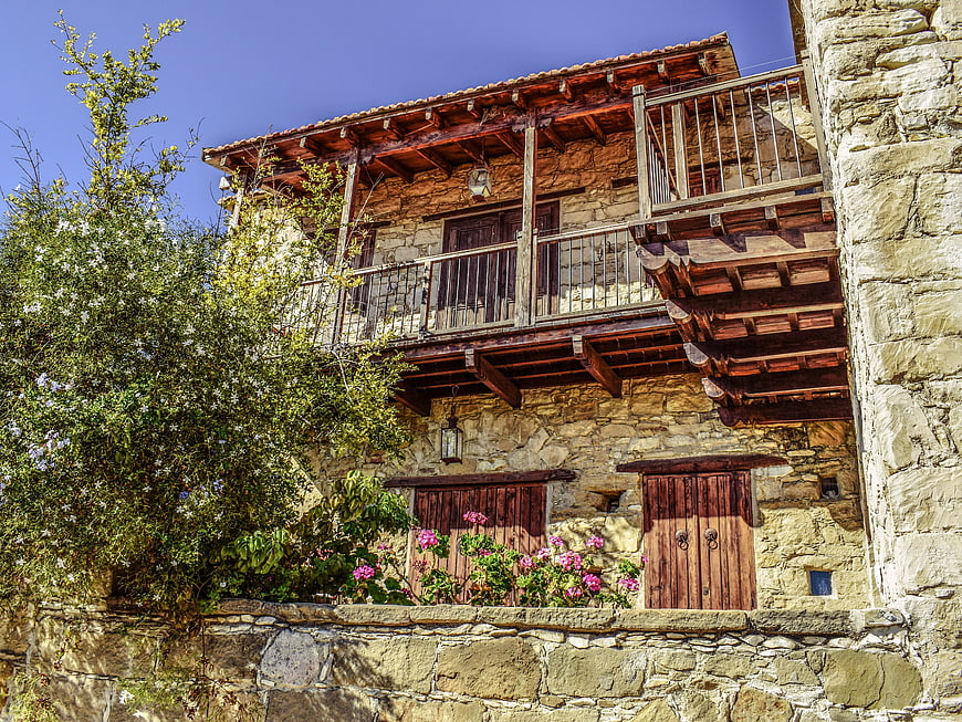 Traditional Stone House with Wooden Balcony in Cyprus Village