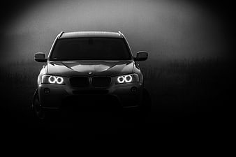 Dramatic Black and White BMW X3 Front View in Fog