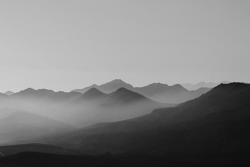 Misty Black and White Mountain Landscape with Foggy Layers