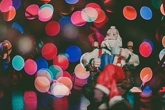 Vintage Santa Claus Figurine with Colorful Bokeh Lights