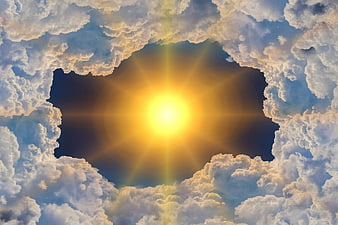 Sun shining through a hole in the clouds