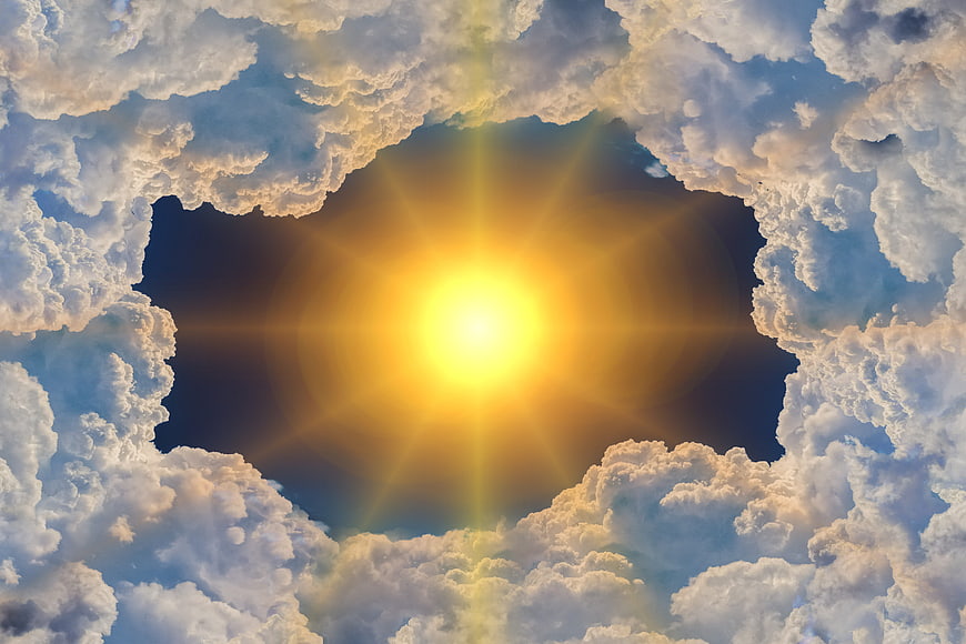 Sun shining through a hole in the clouds