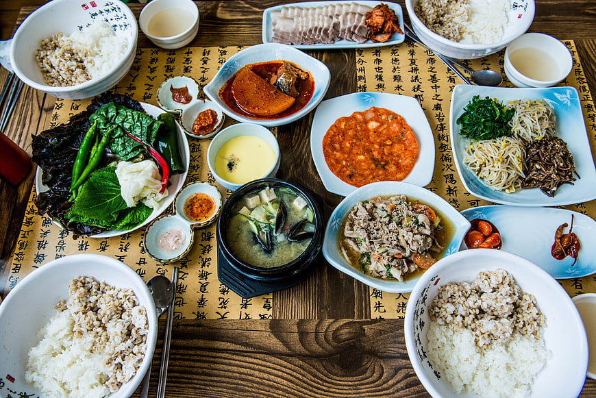 Traditional Korean Feast with Rice, Banchan, and Stew