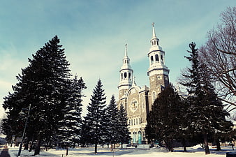 Snowy Catholic Church with Twin Spires in Winter