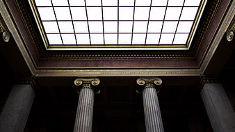 Low angle view of classical columns and skylight ceiling