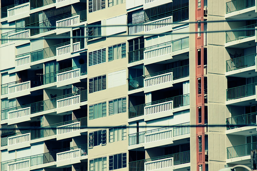 Modern Apartment Building Facade with Balconies and Windows