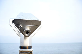 Silver Coin-Operated Binoculars by the Sea