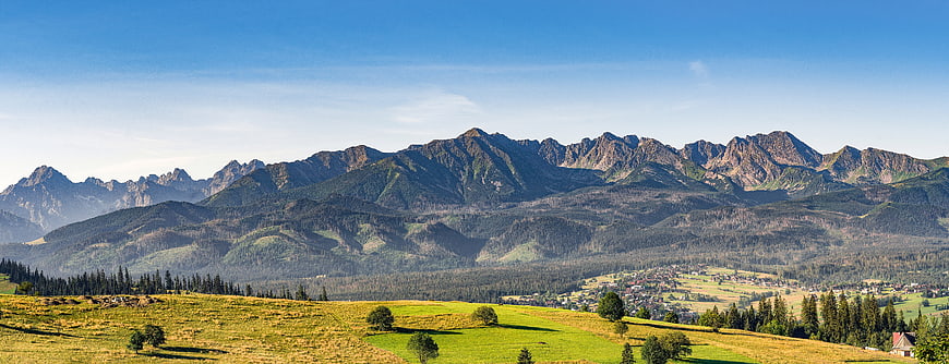 Panoramic View of Tatra Mountains and Green Valley Landscape