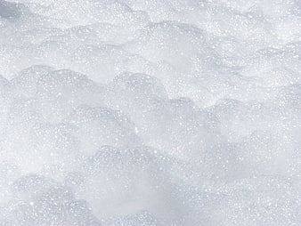 Sparkling White Snow Texture Close-Up Background