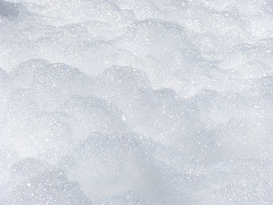 Sparkling White Snow Texture Close-Up Background