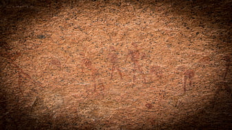 Ancient Rock Art Petroglyphs on Textured Stone Surface