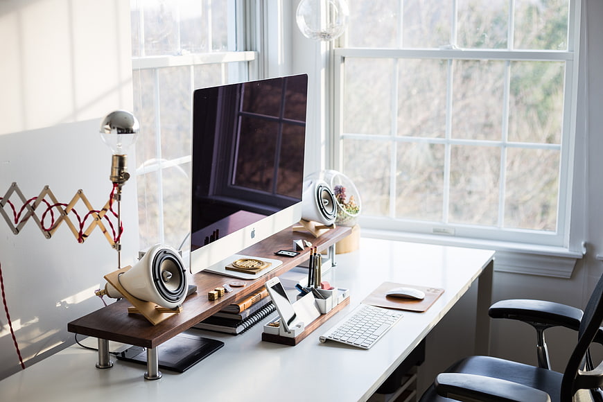 Modern Home Office Workspace with Computer and Natural Light
