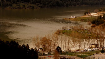 Aerial View of Lake Dam with Recreational Area and Parking