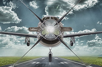 Frontal View of Pilatus PC-12 Aircraft Approaching Runway