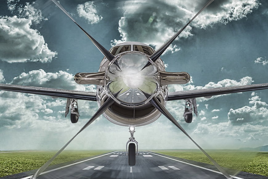 Frontal View of Pilatus PC-12 Aircraft Approaching Runway