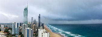 Panoramic View of Gold Coast Skyline and Ocean Under Stormy Skies