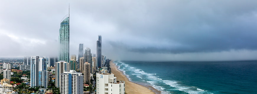 Panoramic View of Gold Coast Skyline and Ocean Under Stormy Skies