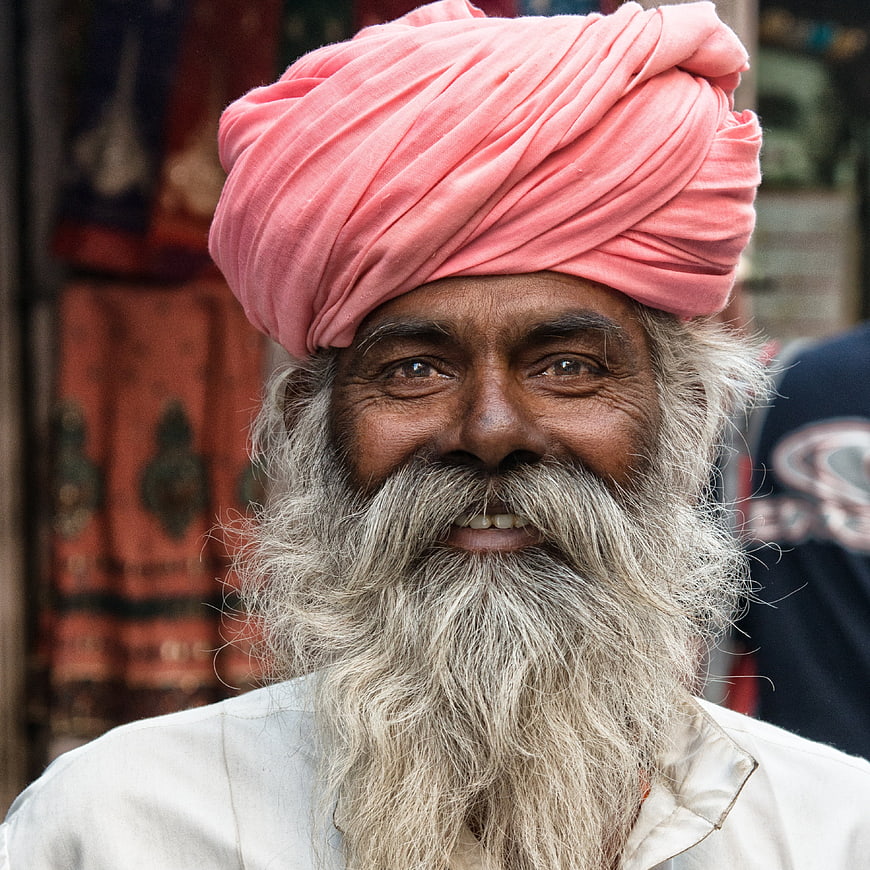 Portrait of elderly Indian man with pink turban and long beard