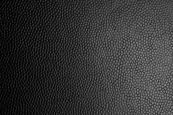 Black textured leather surface background