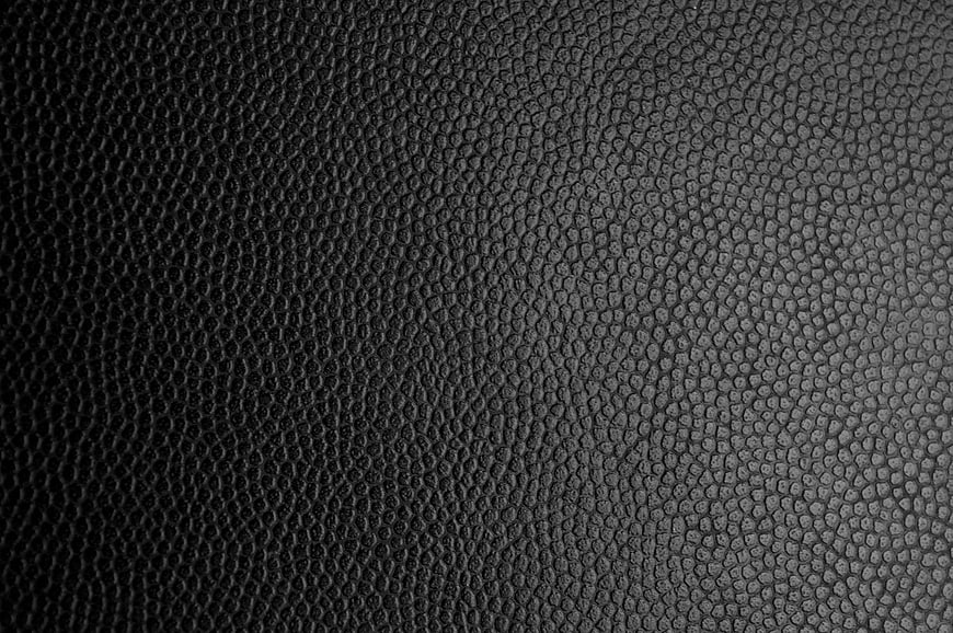 Black textured leather surface background
