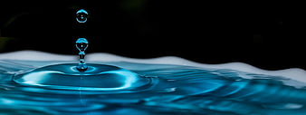 Blue Water Drop Splash on Black Background