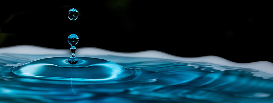 Blue Water Drop Splash on Black Background