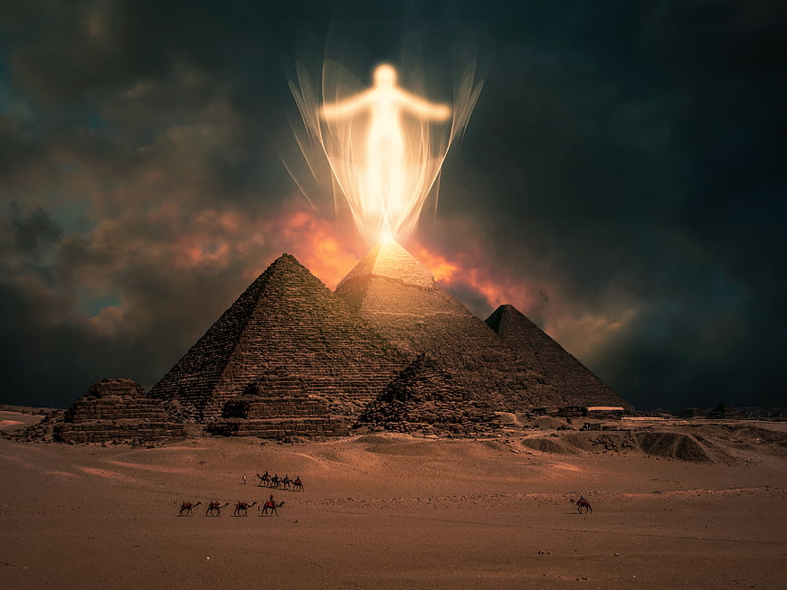 Glowing Spirit Above Egyptian Pyramids in Dramatic Desert Sunset