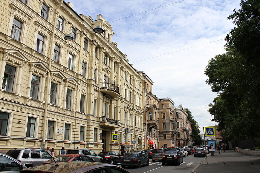 Historic yellow building on a busy street in Saint Petersburg