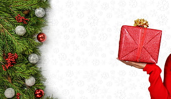 Christmas Gift Box With Pine Branches And Snowflake Background