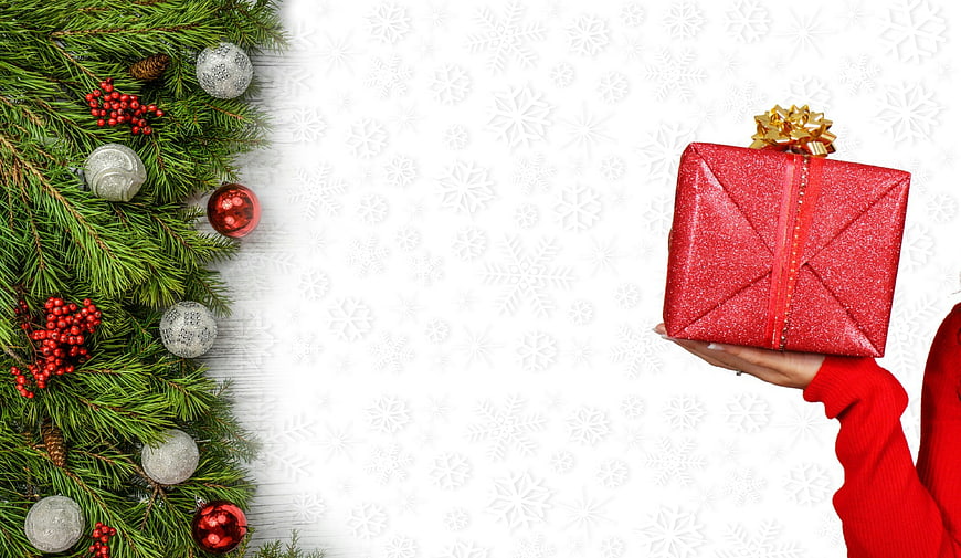 Christmas Gift Box With Pine Branches And Snowflake Background