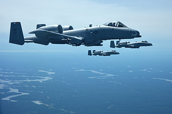 A-10 Thunderbolt II Warthog Formation Flight Over Landscape