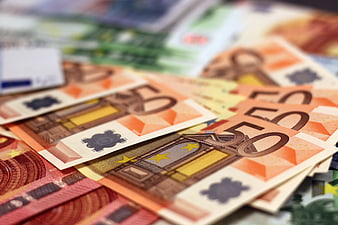 Close-up of scattered 50 euro banknotes with shallow depth of field