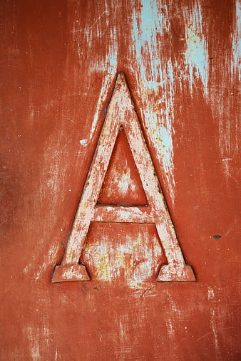 Vintage Embossed Letter A on Rustic Red Wood Texture