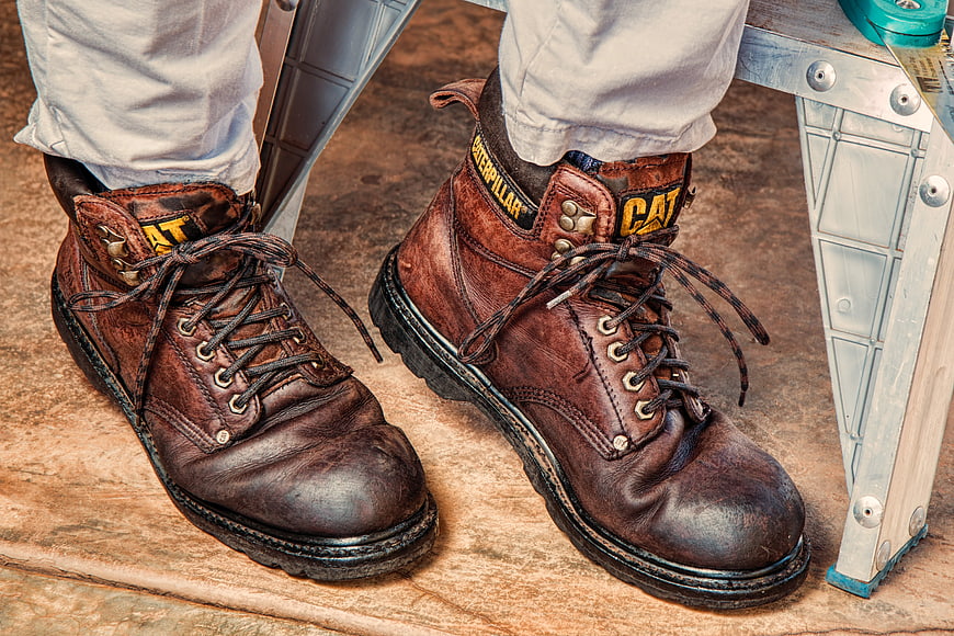 Worn Brown Leather Work Boots on Construction Site