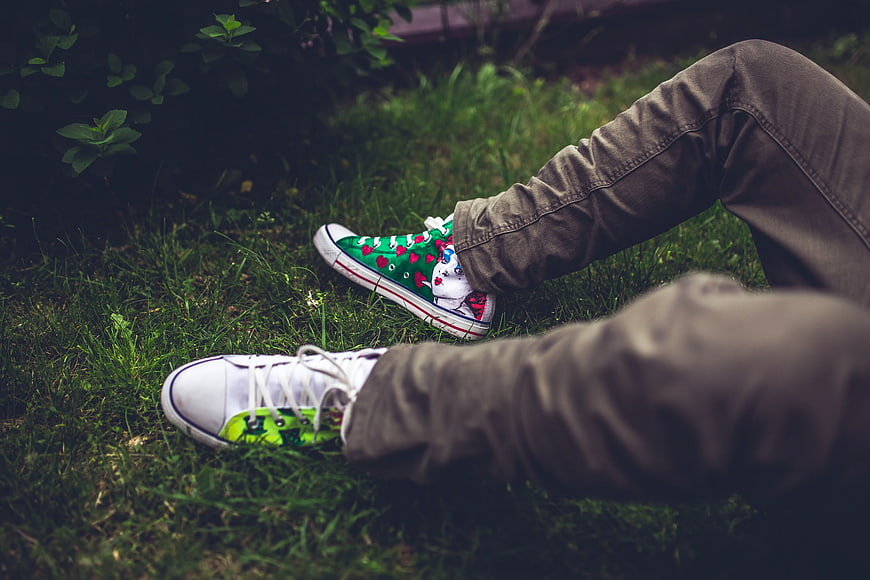 Custom painted sneakers on grass