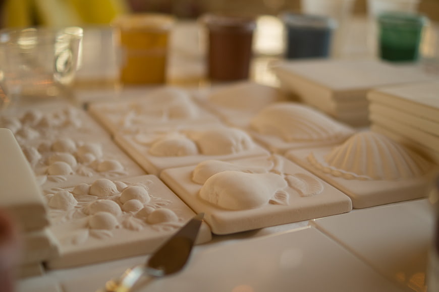 White ceramic tile molds with sea shell and fruit designs