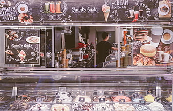 Gelato shop counter with colorful ice cream and menu