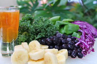 Fresh smoothie ingredients with kale, banana, and blueberries