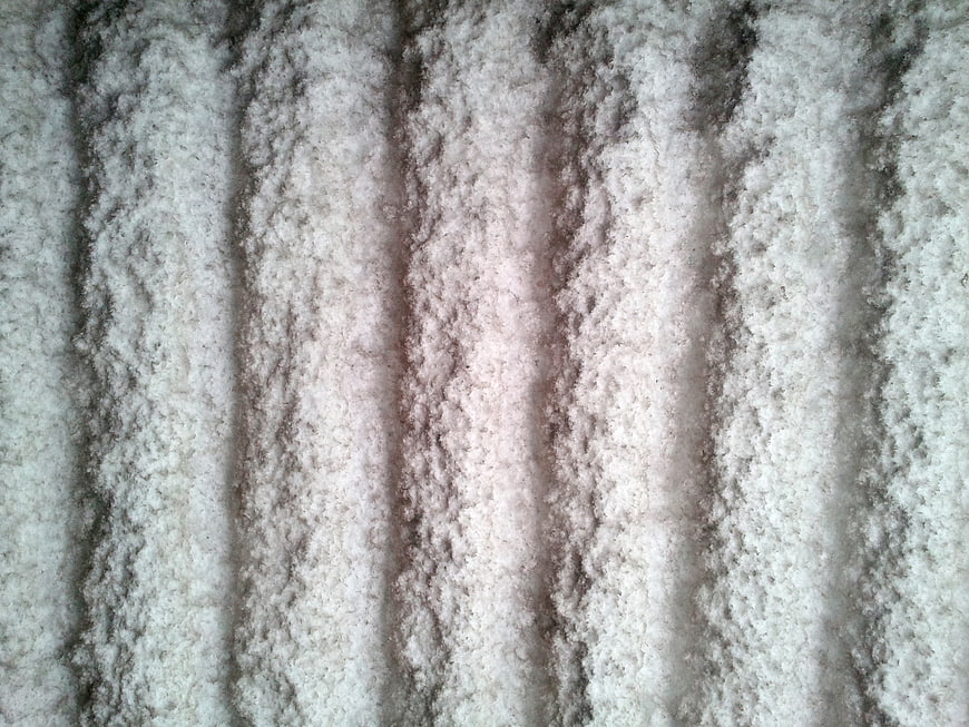 Close-up of rough gray concrete wall texture