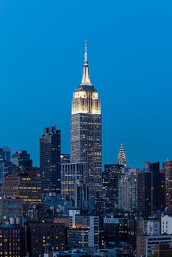 Empire State Building illuminated at twilight in New York City skyline