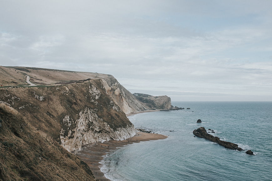 Dramatic coastal cliffs overlooking the ocean on an overcast day