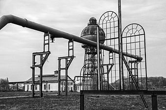 Black and white industrial water tower and pipes