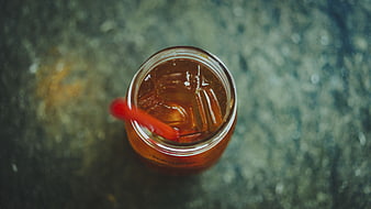 Top View of Iced Tea in Glass Jar with Red Straw
