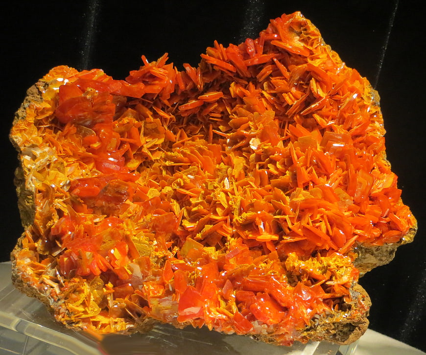 Vibrant Orange Vanadinite Mineral Specimen on Black Background