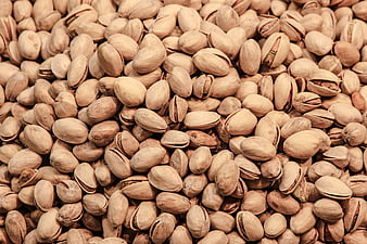 Close-up texture of shelled pistachios in shell