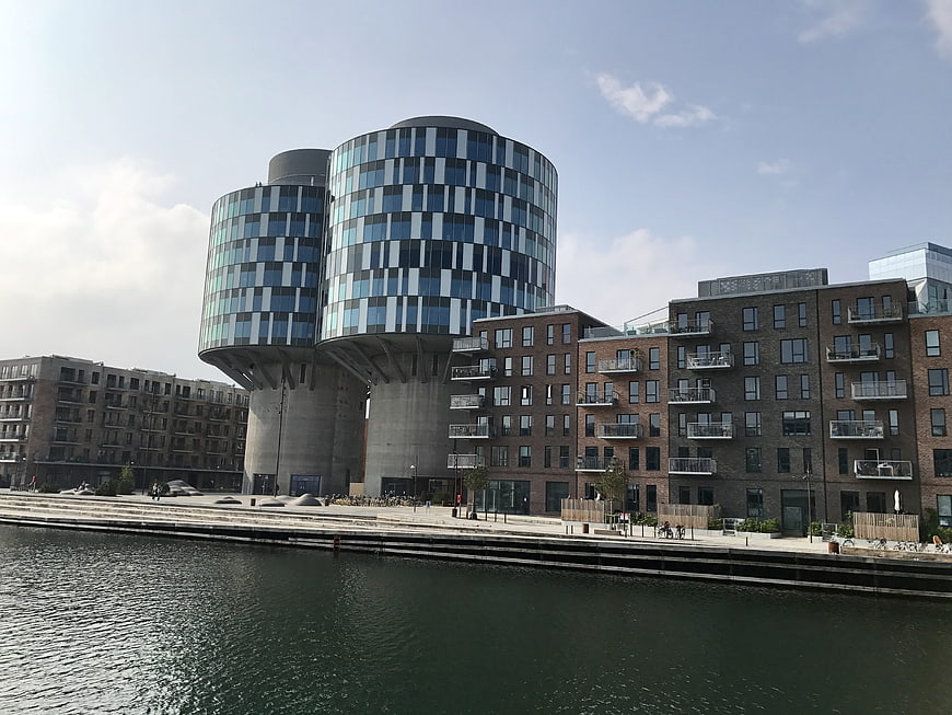 Modern cylindrical glass architecture on Copenhagen waterfront